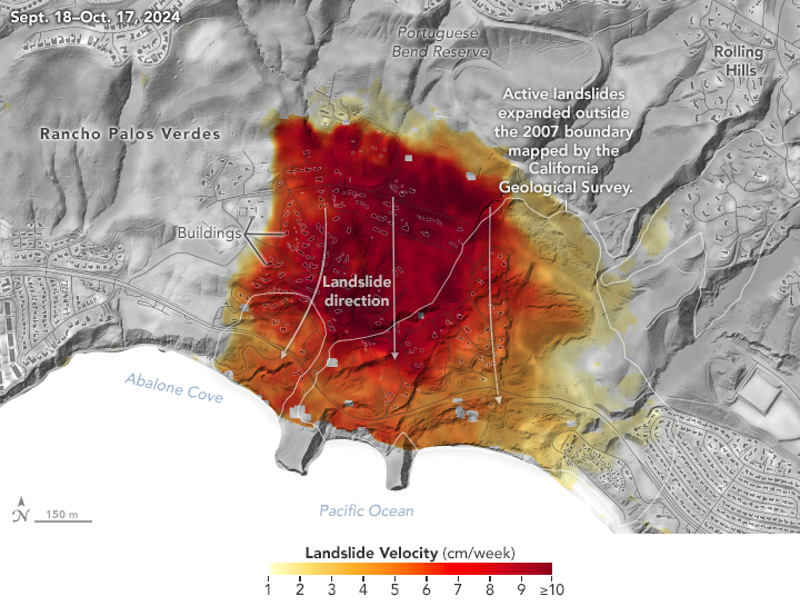 A map of California's Palos Verdes area is overlaid with colors from yellow to red, indicating the pace at which the landslide was moving in autumn 2024. Higher-speed parts of the slide, shown in red, cover the middle of the map and include areas with roads and buildings, shown in gray. Arrows point toward the Pacific Ocean, indicating the direction of the slide.